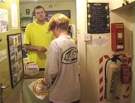 Llewellyn buys some snacks from the hostel shop at Capel-y-Ffin youth hostel
